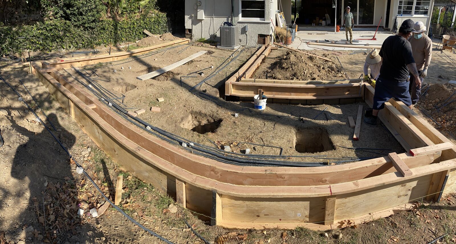 Field crew setting wood foundation forms